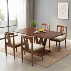High-angle full shot of a premium handcrafted wooden dining room furniture set with 4 chairs placed on a geometric area rug.