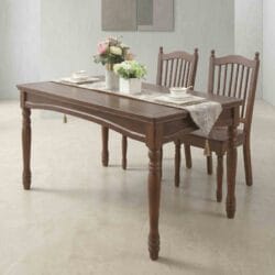 Side view of a premium rectangular dark walnut finish solid wood dining table paired with matching traditional slatted-back chairs.