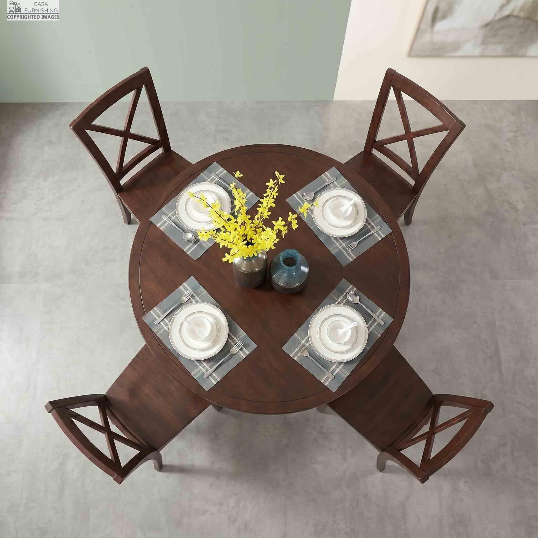 Top-View-of-Round-Sheesham-Wood-4-Seater-Dining-Table-Setting Overhead birds-eye view of a 4-seater round solid wood dining table set featuring stylish cross-back wooden chairs and symmetrical table settings.