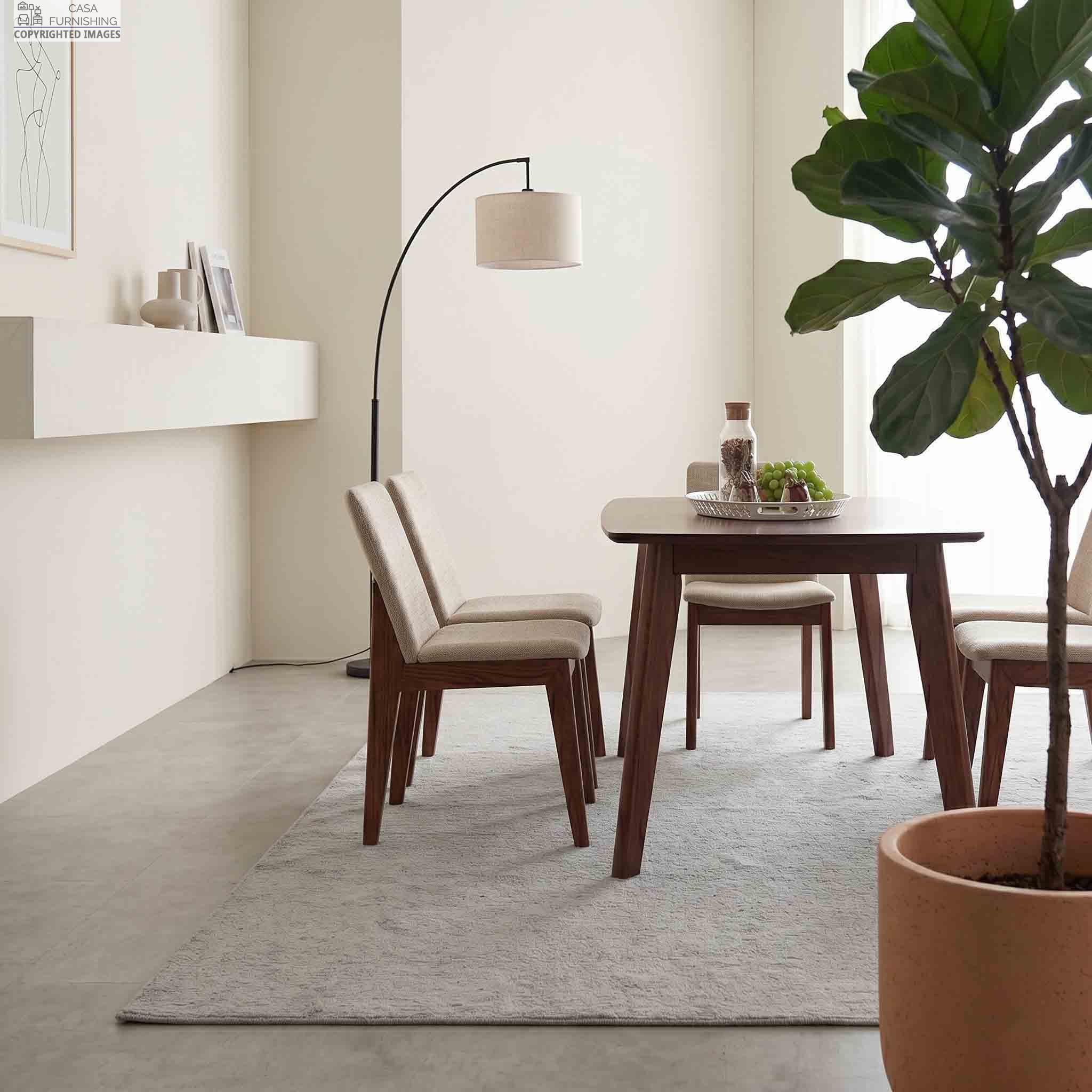 mid-century-modern-wooden-dining-table-and-fabric-chairs-side-view