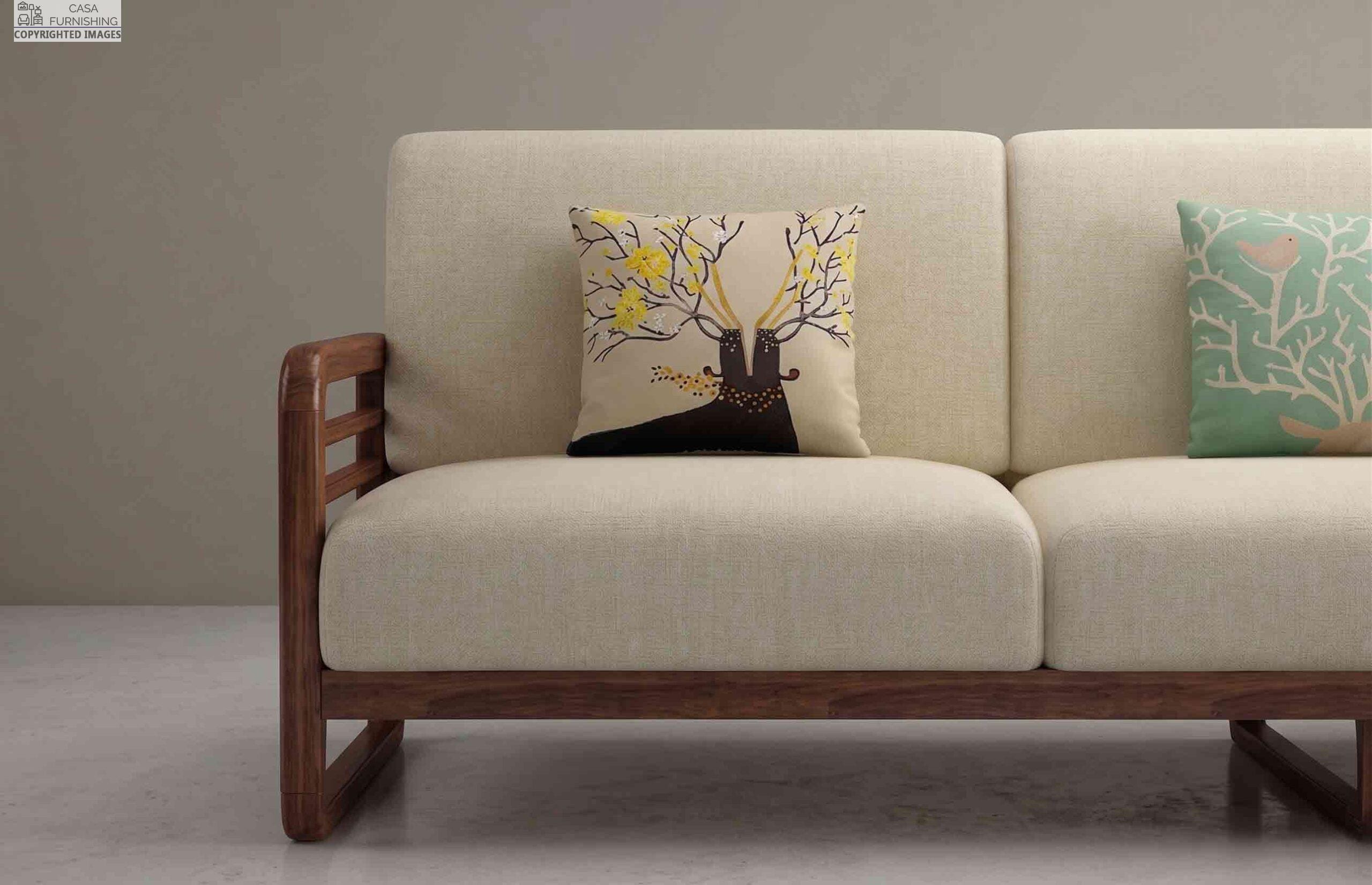 close-up-solid-wood-sofa-armrest-with-nature-print-cushions.jpg