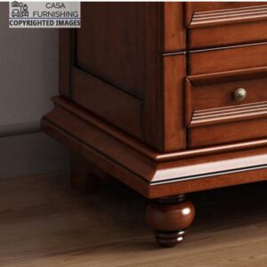 Close-up view of the sturdy turned wooden bun feet and decorative traditional plinth molding base of a Casa Furnishing solid wood wardrobe.