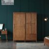 Elegant closed 3-door solid wood wardrobe showcasing natural wood grain finish in a contemporary bedroom setup.