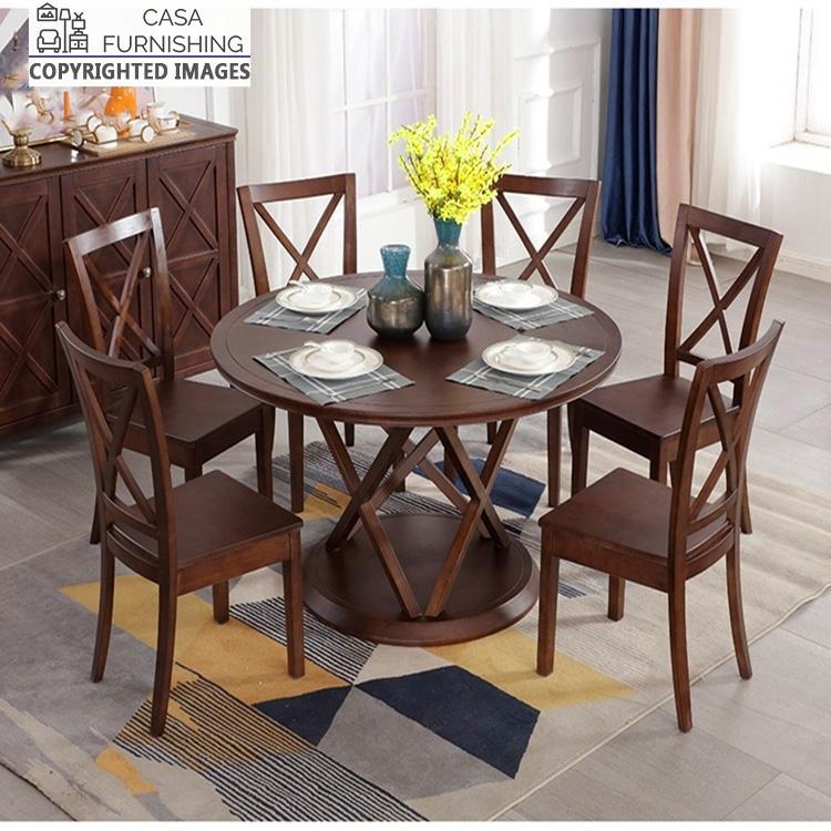 6-seater-round-dining-table-3-1-1-1.jpg Round solid wood 6-seater dining table set with cross-back chairs in a dark walnut finish by Casa Furnishing.