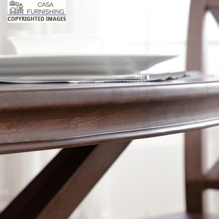 6-seater-round-dining-table-7-1-1-1.jpg Macro detail of the smooth beveled edge and rich natural wood grain on a solid wood dining table in a dark walnut finish by Casa Furnishing.