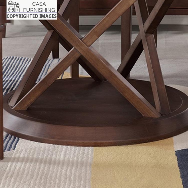6-seater-round-dining-table-9-1-1-1.jpg Detailed close-up of the handcrafted geometric pedestal base for a solid wood dining table in a dark walnut finish by Casa Furnishing.