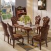 Elegant solid wood traditional dining set with ornate carvings and premium leather seating from the Casa Furnishing collection.