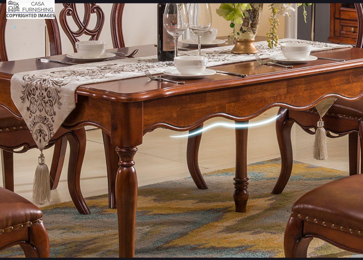 dining-room-sets-5-1-1-1-1.jpg Traditional solid wood dining table with a rich mahogany finish and elegant scalloped edges, styled with premium matching chairs by Casa Furnishing.