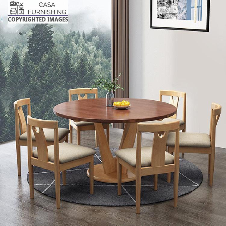 round-dining-table-6-seater-3-1-1-1.jpg Casa Furnishing round solid wood 6-seater dining table set with beige upholstered chairs. A handcrafted wooden furniture ensemble featuring a sophisticated two-tone finish for contemporary dining spaces.