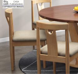The shot features the contrast between the light-wood chairs and a rich, dark-toned circular tabletop, emphasizing high-end furniture design.