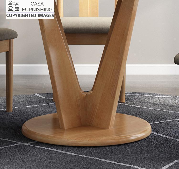 round-dining-table-6-seater-7-1-1-1.jpg This detailed shot highlights the unique V-shaped design and natural grain finish of our premium wooden furniture.