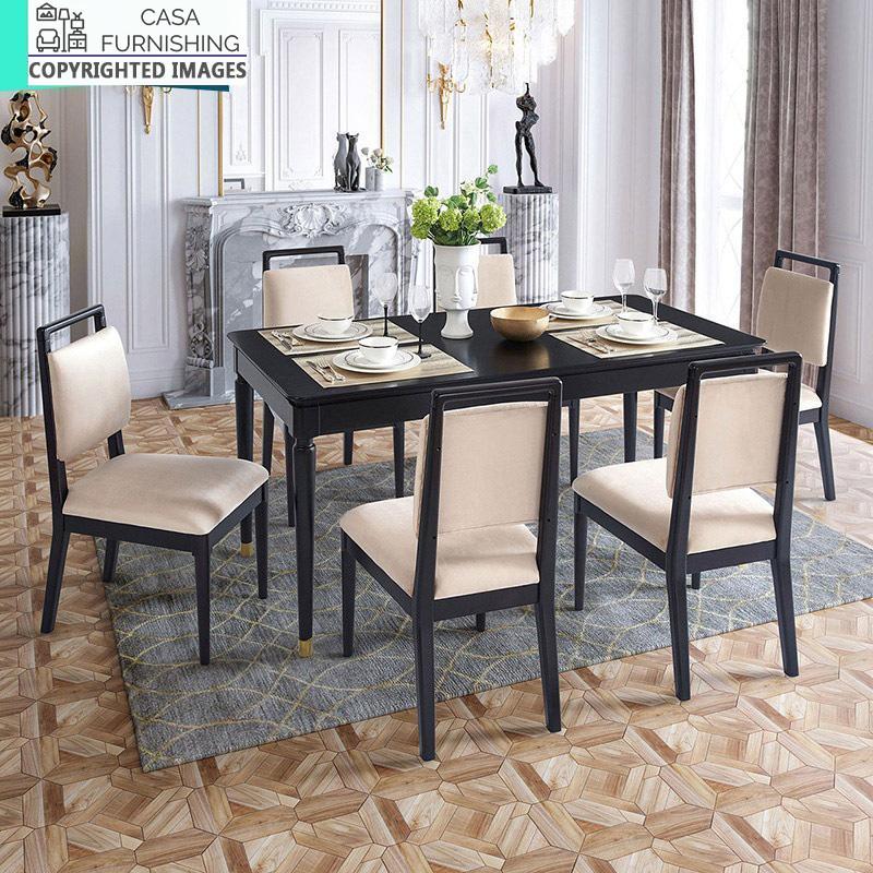wooden-dining-table-set-1-1-1-1.jpg Elegant 6-seater solid wood dining table set in a modern black finish with beige upholstered chairs and gold-accented legs by Casa Furnishing.