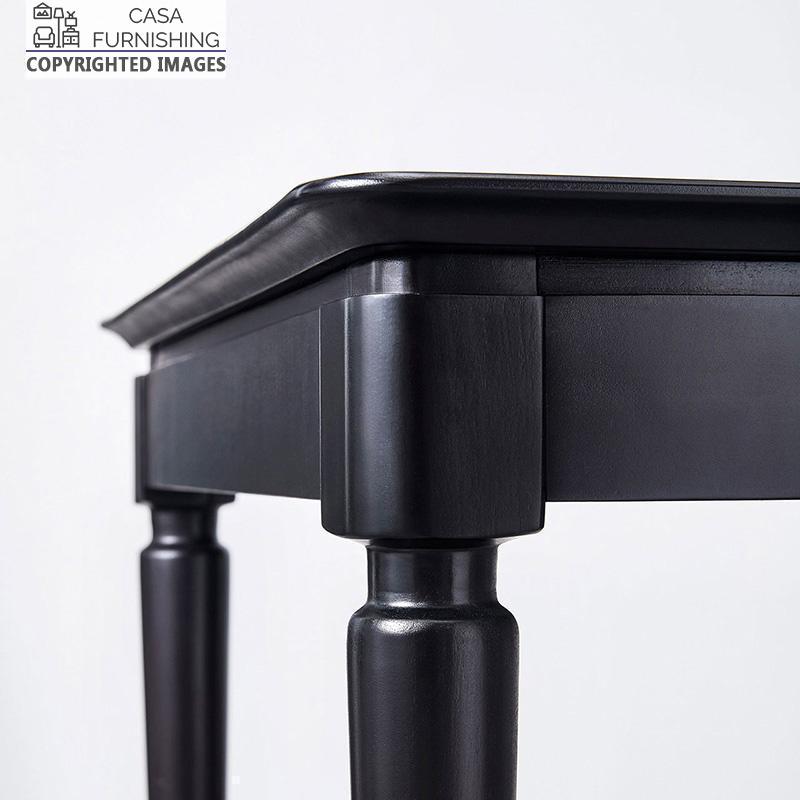 wooden-dining-table-set-4-1-1-1.jpg Close-up of a handcrafted black solid wood table corner by Casa Furnishing, showing premium joinery and a sleek matte finish. Durable and stylish wooden furniture for modern home decor.